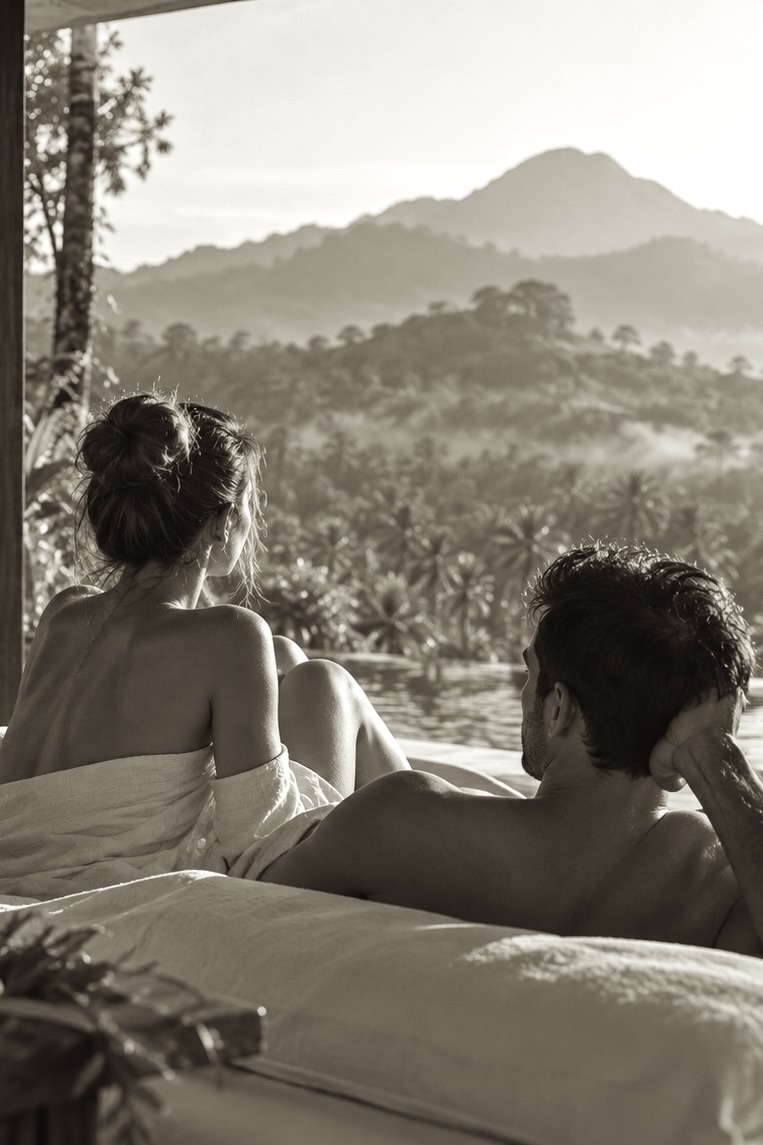 A couple at the spa, looking out over the misty valley